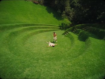 Movie still from “Elton John, Britney Spears - Hold Me Closer” (2022), directed by Tanu Muiño – Extreme Wide shot, Overhead angle