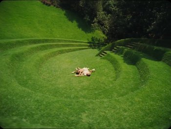 Movie still from “Elton John, Britney Spears - Hold Me Closer” (2022), directed by Tanu Muiño – Extreme Wide shot, Overhead angle