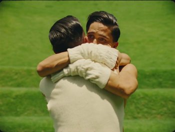 Movie still from “Elton John, Britney Spears - Hold Me Closer” (2022), directed by Tanu Muiño – Medium shot, Over the shoulder angle