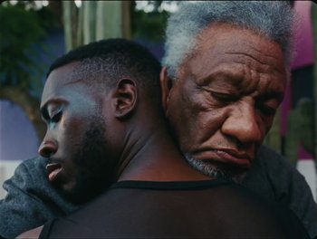 Movie still from “Elton John, Britney Spears - Hold Me Closer” (2022), directed by Tanu Muiño – Close Up shot, Low angle