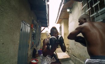 Movie still from “Oko Ebombo - Nalingi Yo” (2022), directed by Frank Lebon – Medium shot, High angle