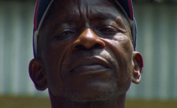 Movie still from “Oko Ebombo - Nalingi Yo” (2022), directed by Frank Lebon – Extreme Close Up shot, Low angle