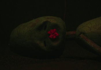 Movie still from “Lila Drew - Bad Juice” (2022), directed by Vincent Haycock – Extreme Close Up shot, Overhead angle