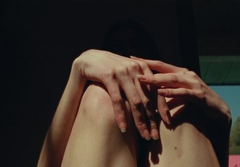 Movie still from “Lila Drew - Bad Juice” (2022), directed by Vincent Haycock – Extreme Close Up shot, Overhead angle