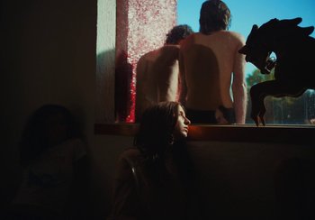 Movie still from “Lila Drew - Bad Juice” (2022), directed by Vincent Haycock – Medium shot, Low angle