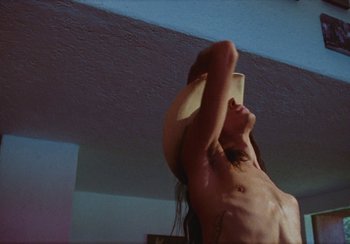 Movie still from “Lila Drew - Bad Juice” (2022), directed by Vincent Haycock – Medium shot, Low angle