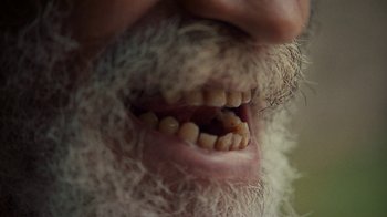 Movie still from “Loyle Carner - Georgetown” (2022), directed by Machine Operated – Extreme Close Up shot, Overhead angle