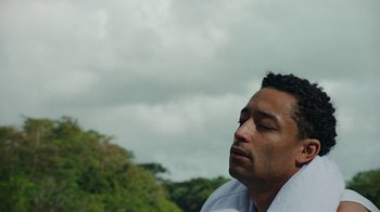 Movie still from “Loyle Carner - Georgetown” (2022), directed by Machine Operated – Close Up shot, Low angle