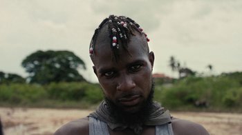 Movie still from “Loyle Carner - Georgetown” (2022), directed by Machine Operated – Close Up shot, Low angle