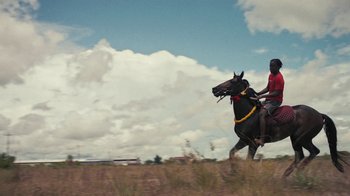 Movie still from “Loyle Carner - Georgetown” (2022), directed by Machine Operated – Extreme Wide shot, Low angle