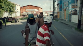 Movie still from “Loyle Carner - Georgetown” (2022), directed by Machine Operated – Wide shot, High angle