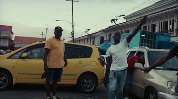 Movie still from “Loyle Carner - Georgetown” (2022), directed by Machine Operated – Wide shot, Low angle
