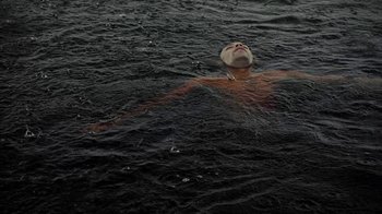 Movie still from “Loyle Carner - Georgetown” (2022), directed by Machine Operated – Wide shot, Overhead angle