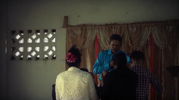 Movie still from “Loyle Carner - Georgetown” (2022), directed by Machine Operated – Medium shot, High angle