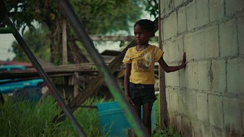 Movie still from “Loyle Carner - Georgetown” (2022), directed by Machine Operated – Medium shot, High angle