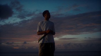 Movie still from “Loyle Carner - Georgetown” (2022), directed by Machine Operated – Medium shot, Low angle