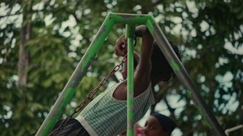 Movie still from “Loyle Carner - Georgetown” (2022), directed by Machine Operated – Medium shot, High angle