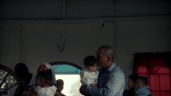 Movie still from “Loyle Carner - Georgetown” (2022), directed by Machine Operated – Medium shot, Low angle