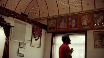 Movie still from “Loyle Carner - Georgetown” (2022), directed by Machine Operated – Wide shot, High angle