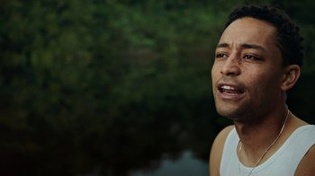 Movie still from “Loyle Carner - Georgetown” (2022), directed by Machine Operated – Close Up shot, Low angle