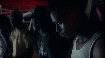 Movie still from “Loyle Carner - Georgetown” (2022), directed by Machine Operated – Close Up shot, Low angle