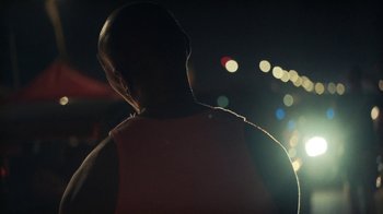 Movie still from “Loyle Carner - Georgetown” (2022), directed by Machine Operated – Close Up shot, Low angle