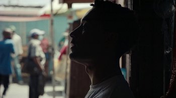 Movie still from “Loyle Carner - Georgetown” (2022), directed by Machine Operated – Close Up shot, Low angle