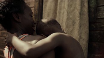 Movie still from “Loyle Carner - Georgetown” (2022), directed by Machine Operated – Close Up shot, Over the shoulder angle