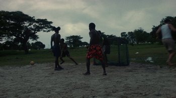Movie still from “Loyle Carner - Georgetown” (2022), directed by Machine Operated – Extreme Wide shot, High angle