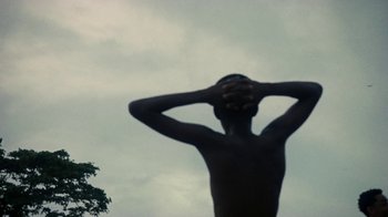 Movie still from “Loyle Carner - Georgetown” (2022), directed by Machine Operated – Medium shot, Low angle