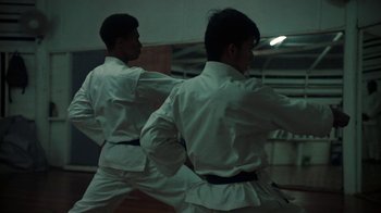 Movie still from “Loyle Carner - Georgetown” (2022), directed by Machine Operated – Medium shot, Low angle