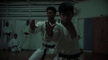 Movie still from “Loyle Carner - Georgetown” (2022), directed by Machine Operated – Medium shot, Low angle