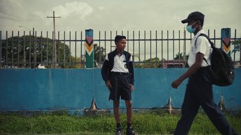 Movie still from “Loyle Carner - Georgetown” (2022), directed by Machine Operated – Wide shot, Low angle