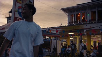 Movie still from “Loyle Carner - Georgetown” (2022), directed by Machine Operated – Medium shot, Low angle