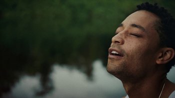 Movie still from “Loyle Carner - Georgetown” (2022), directed by Machine Operated – Close Up shot, Low angle