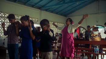 Movie still from “Loyle Carner - Georgetown” (2022), directed by Machine Operated – Medium shot, High angle