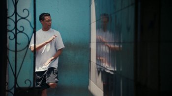 Movie still from “Loyle Carner - Georgetown” (2022), directed by Machine Operated – Medium shot, Low angle