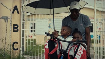 Movie still from “Loyle Carner - Georgetown” (2022), directed by Machine Operated – Medium shot, High angle