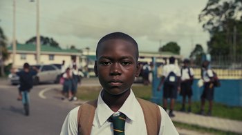 Movie still from “Loyle Carner - Georgetown” (2022), directed by Machine Operated – Close Up shot, Low angle