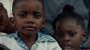 Movie still from “Loyle Carner - Georgetown” (2022), directed by Machine Operated – Extreme Close Up shot, Low angle