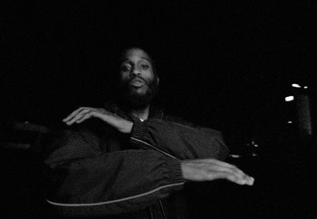Movie still from “Maxo - 48” (2022), directed by Vincent Haycock – Medium shot, Low angle