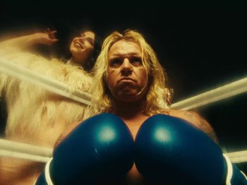 Movie still from “Black Midi - Sugar_Tzu” (2022), directed by Noel Paul – Medium shot, Low angle