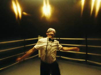 Movie still from “Black Midi - Sugar/Tzu” (2022), directed by Noel Paul – Medium shot, Low angle