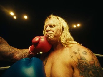 Movie still from “Black Midi - Sugar/Tzu” (2022), directed by Noel Paul – Medium shot, Low angle