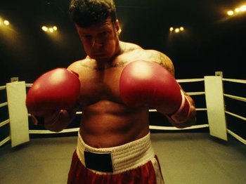 Movie still from “Black Midi - Sugar/Tzu” (2022), directed by Noel Paul – Medium shot, Low angle