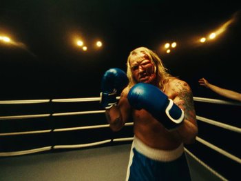 Movie still from “Black Midi - Sugar_Tzu” (2022), directed by Noel Paul – Medium shot, High angle