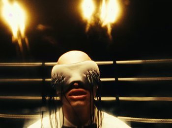 Movie still from “Black Midi - Sugar_Tzu” (2022), directed by Noel Paul – Extreme Close Up shot, Overhead angle
