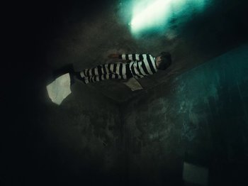 Movie still from “Black Midi - Sugar_Tzu” (2022), directed by Noel Paul – Wide shot, Overhead angle