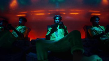 Movie still from “Pharrell - Cash In Cash Out” (2022), directed by François Rousselet – Medium shot, Low angle