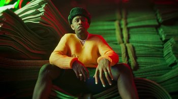 Movie still from “Pharrell - Cash In Cash Out” (2022), directed by François Rousselet – Medium shot, Low angle